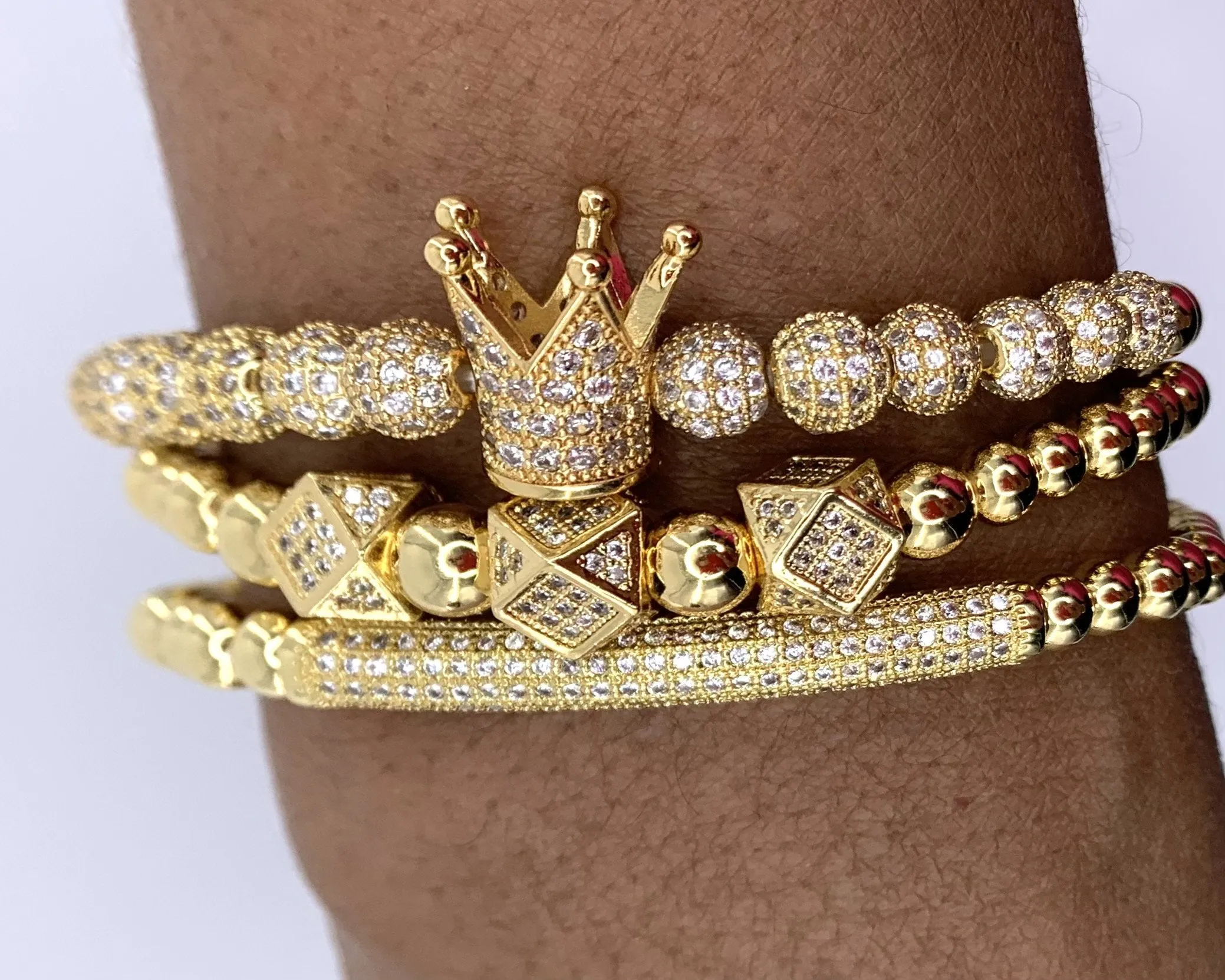 14 karat gold crown & dice charm bracelet set