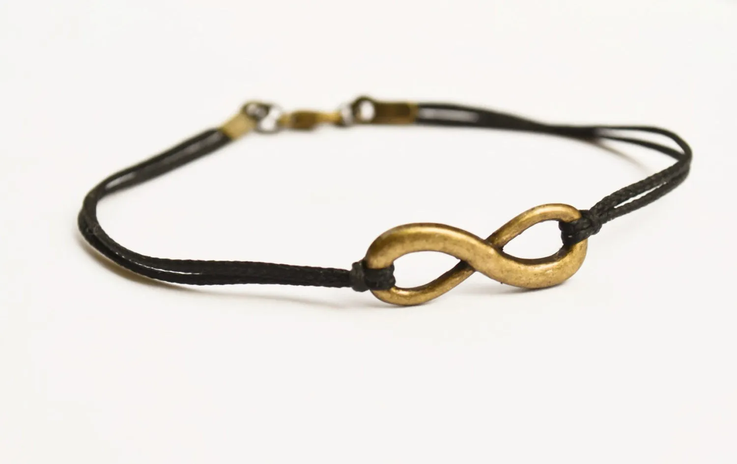 Infinity bracelet for men, bronze charm, black cord yoga jewelry for him