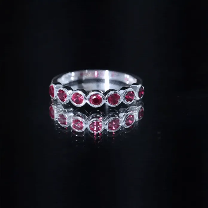 Minimal Created Ruby Half Eternity Ring in Bezel Setting