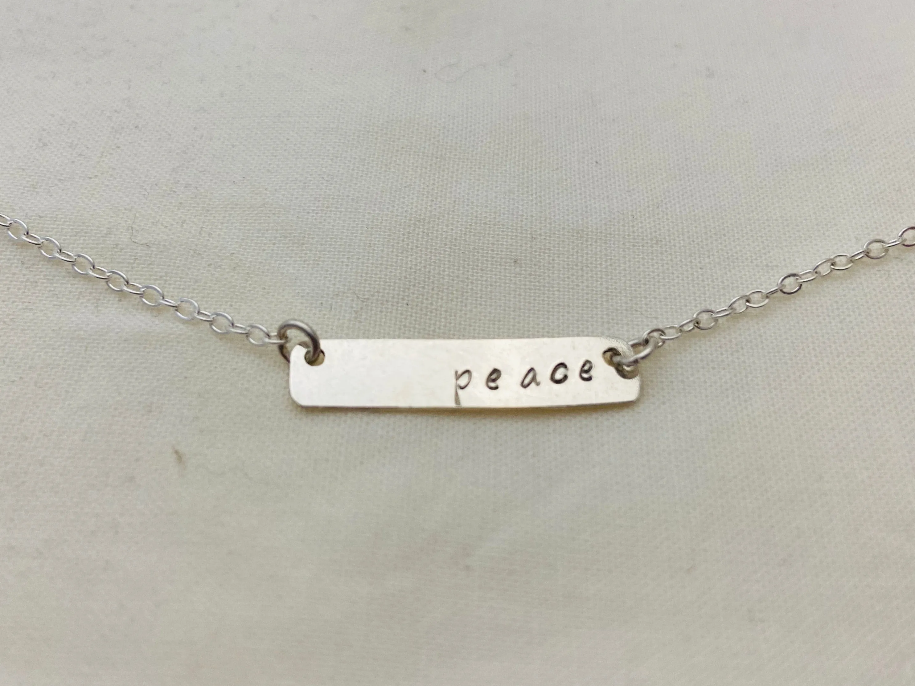 Peace Stamped Bar Pendant