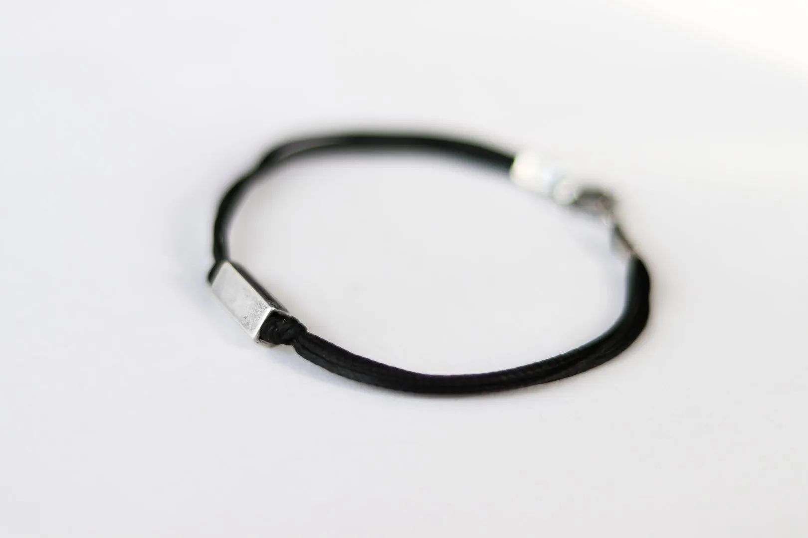 Silver bead bracelet for men, black cord, geometric jewelry