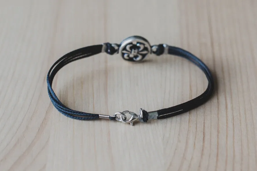 Silver Fleur de lis bracelet for men, black cord, lily flower charm