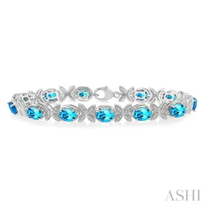 SS 0.10 CTW Round Cut Diamond and 7x5MM Oval Cut Blue Topaz Bracelet